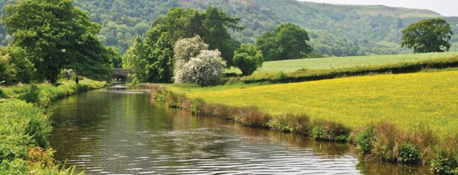 Beautiful Open Countryside Around Canal and Bridge