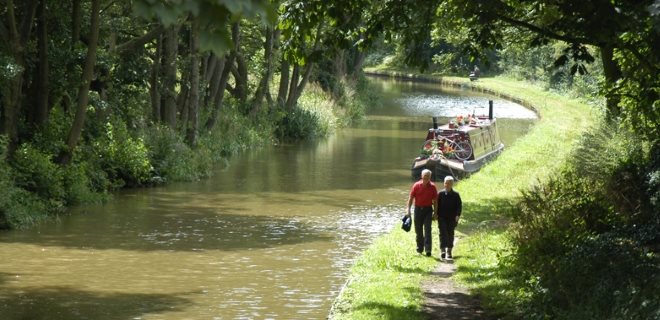 Couple Walking Along Canal Towpath